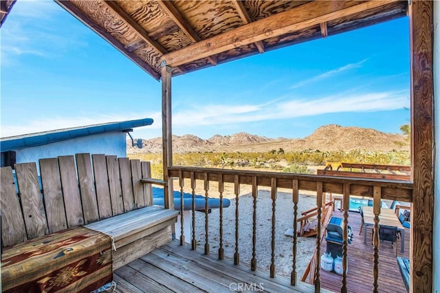 wooden deck with a mountain view