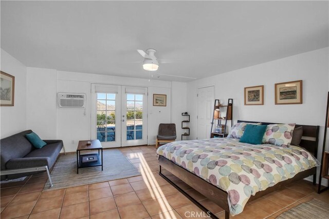 bedroom with ceiling fan, a wall unit AC, light tile patterned flooring, access to exterior, and french doors