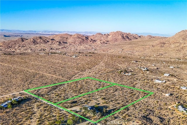 bird's eye view featuring view of desert, a rural view, and a mountain view