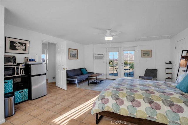 bedroom featuring light tile patterned floors, a ceiling fan, freestanding refrigerator, access to outside, and french doors