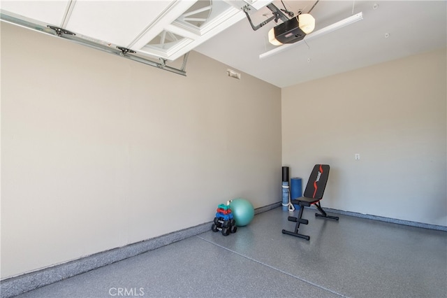 exterior space with a garage and baseboards