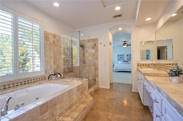 ensuite bathroom with visible vents, a stall shower, recessed lighting, vanity, and a whirlpool tub