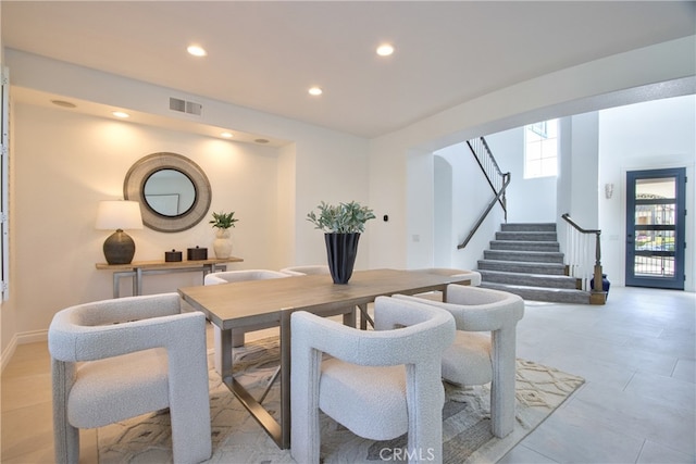 dining space with stairway, recessed lighting, and visible vents