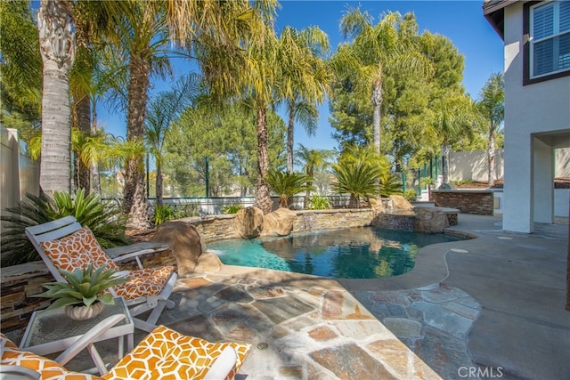 view of pool featuring a fenced in pool, a patio, and a fenced backyard