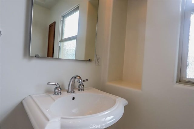 bathroom with a wealth of natural light and a sink