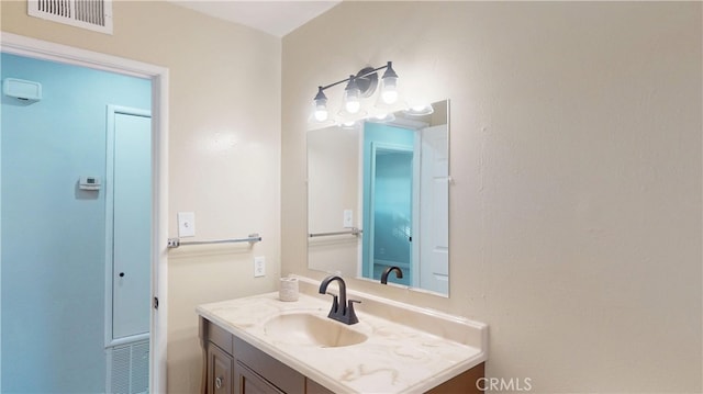 bathroom featuring visible vents and vanity