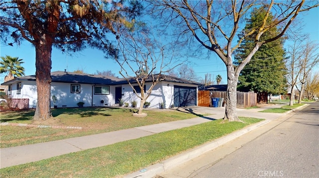 ranch-style house featuring concrete driveway, crawl space, fence, a garage, and a front lawn