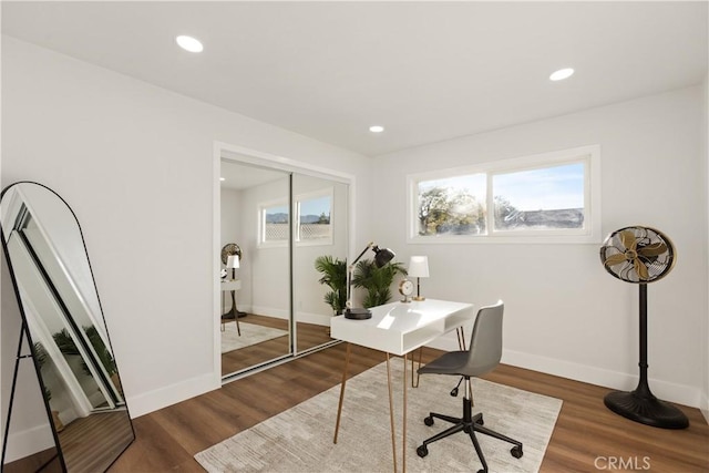 office space with baseboards, wood finished floors, and recessed lighting