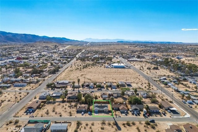 aerial view featuring view of desert and a mountain view