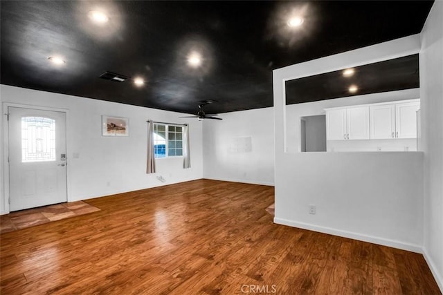 entryway featuring visible vents, a ceiling fan, and wood finished floors