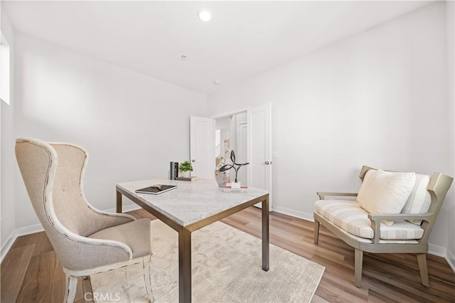 office with light wood-type flooring, baseboards, and recessed lighting