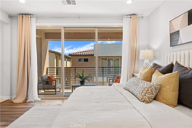 bedroom with access to outside, visible vents, recessed lighting, and wood finished floors