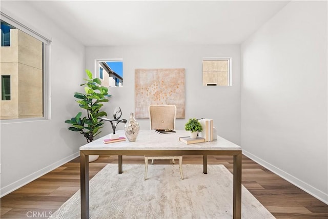 office with baseboards and wood finished floors