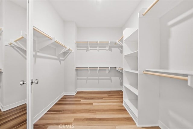 spacious closet with wood finished floors