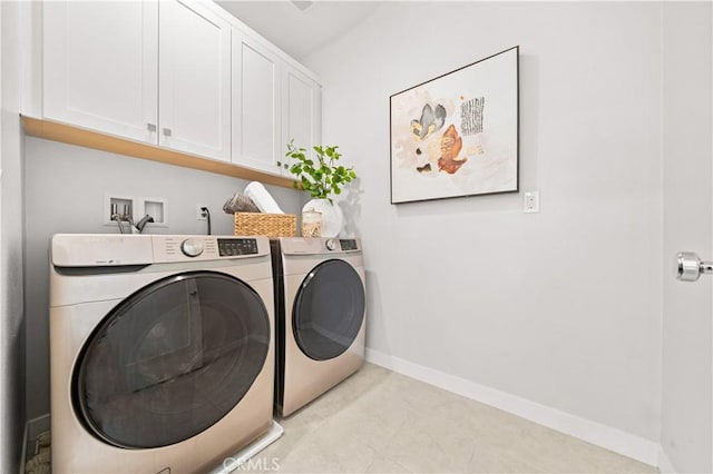 clothes washing area featuring cabinet space, independent washer and dryer, and baseboards