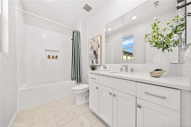 bathroom with visible vents, vanity, toilet, and shower / bath combo with shower curtain