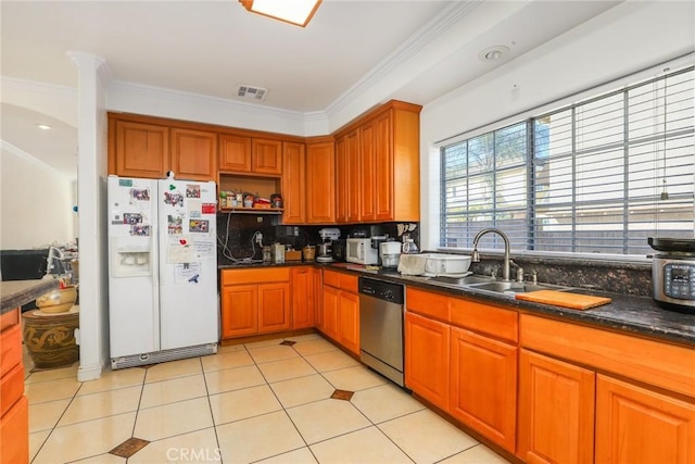 kitchen with crown molding, visible vents, stainless steel dishwasher, a sink, and white fridge with ice dispenser