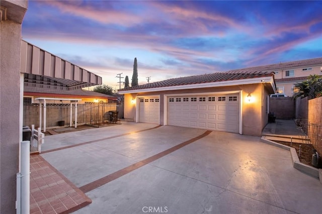 detached garage featuring fence