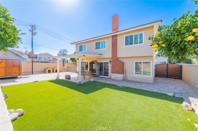 back of house with a patio, a chimney, a fenced backyard, and stucco siding