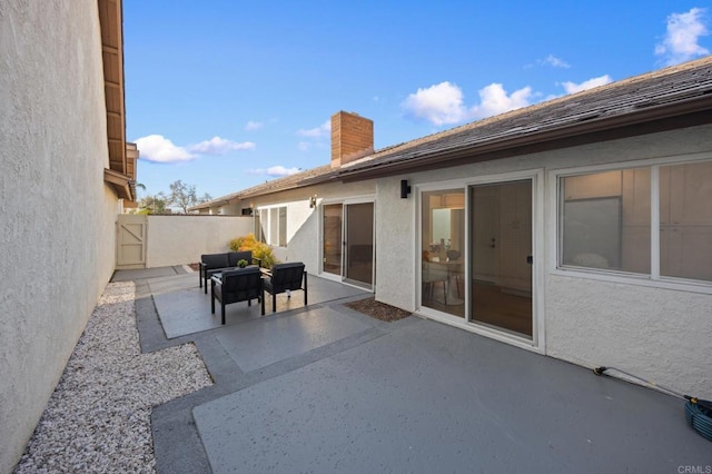 view of patio with fence and an outdoor hangout area