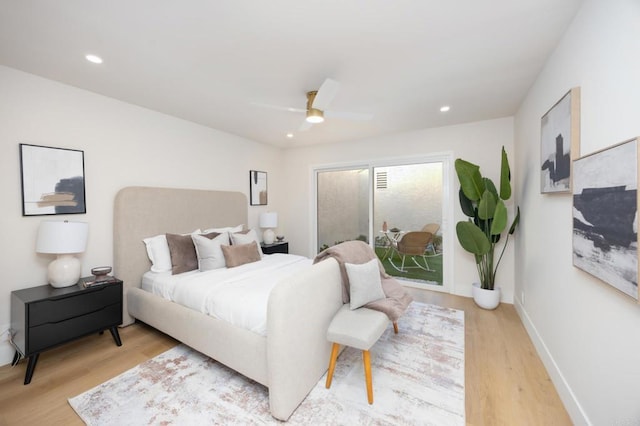 bedroom with light wood-type flooring, access to outside, baseboards, and recessed lighting