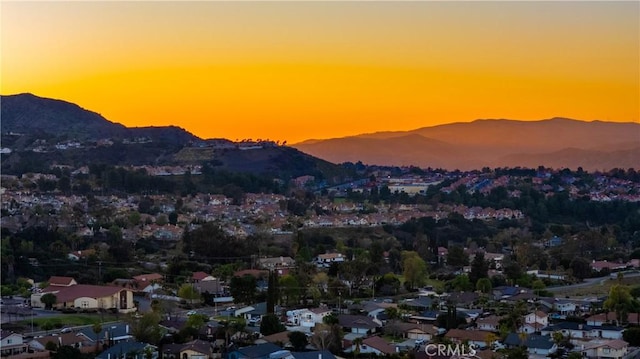 property view of mountains featuring a residential view