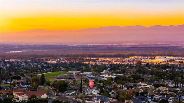 birds eye view of property featuring a mountain view