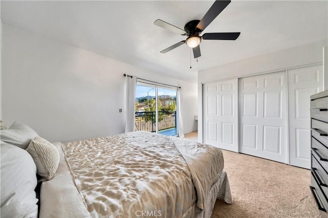 bedroom featuring light carpet, access to exterior, ceiling fan, and a closet