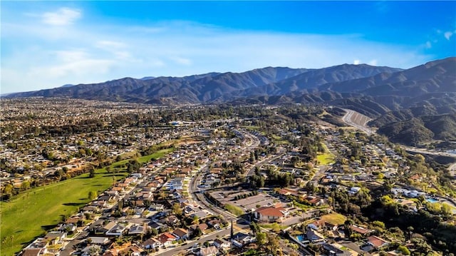 drone / aerial view featuring a residential view and a mountain view