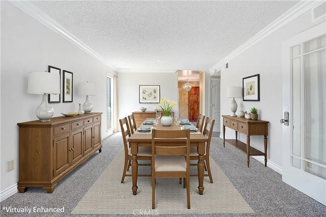 dining area featuring visible vents, crown molding, a textured ceiling, and baseboards