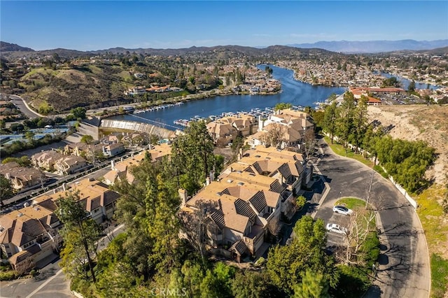 birds eye view of property featuring a water and mountain view