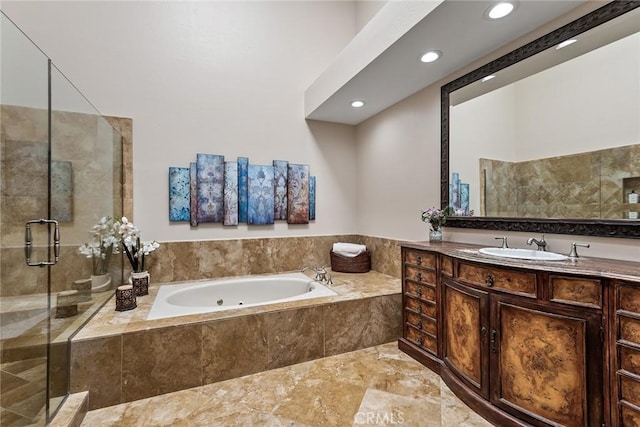 full bathroom featuring recessed lighting, a garden tub, a shower stall, and vanity