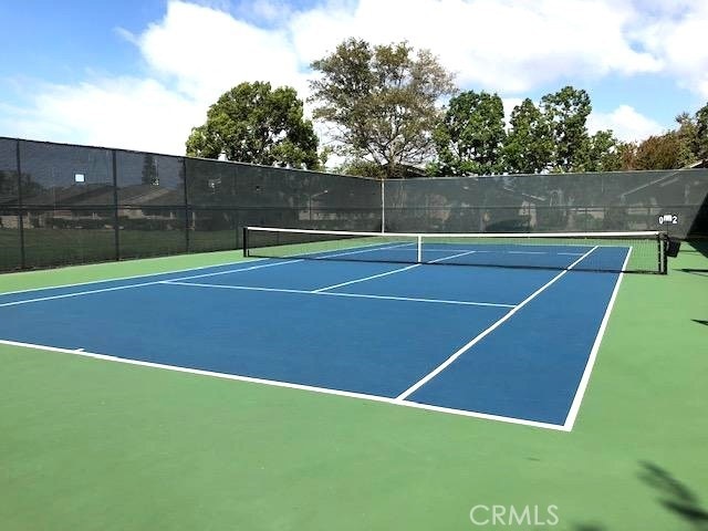 view of sport court with fence