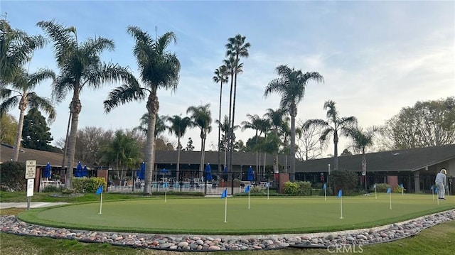 view of home's community with fence