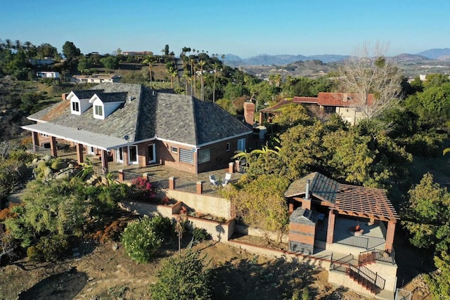 birds eye view of property featuring a mountain view