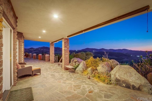 view of patio / terrace with a mountain view