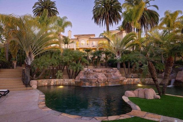 view of pool featuring stairway