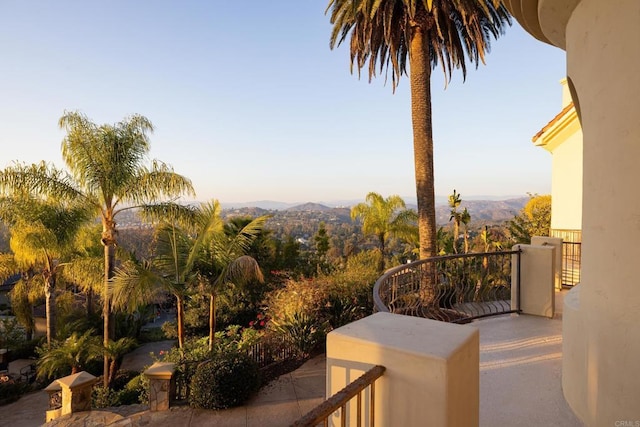 view of patio / terrace with a balcony and a mountain view