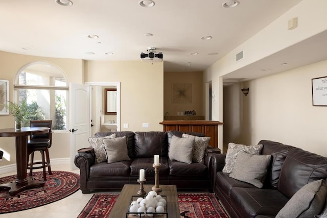 tiled living room featuring recessed lighting and visible vents