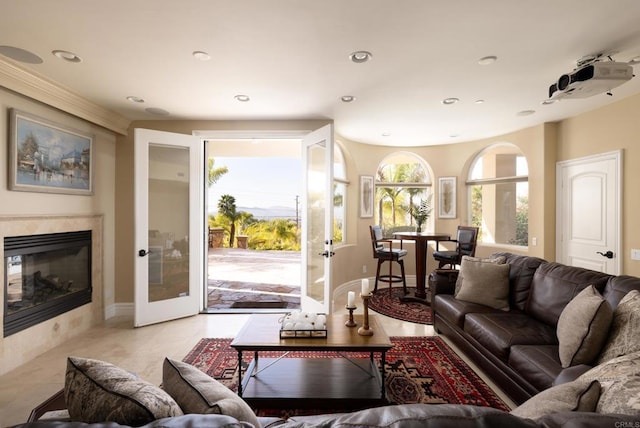 living room featuring recessed lighting, french doors, and a fireplace