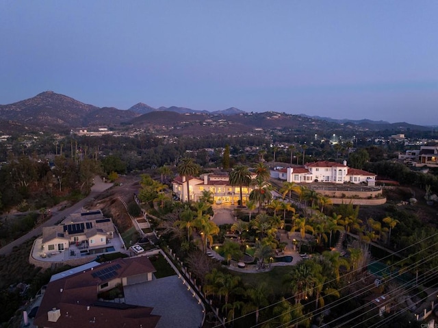 birds eye view of property with a mountain view