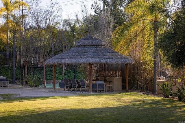 view of community with a lawn, a gazebo, and a patio