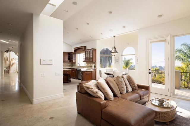 living area featuring recessed lighting, baseboards, and light tile patterned floors