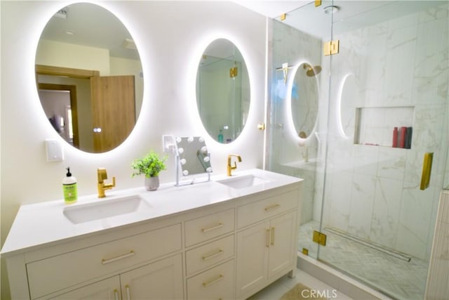 full bath with double vanity, a marble finish shower, and a sink