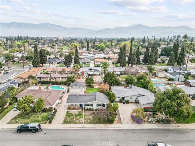 drone / aerial view with a residential view and a mountain view