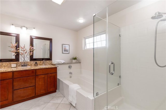 bathroom featuring a stall shower, tile patterned flooring, a bath, and vanity