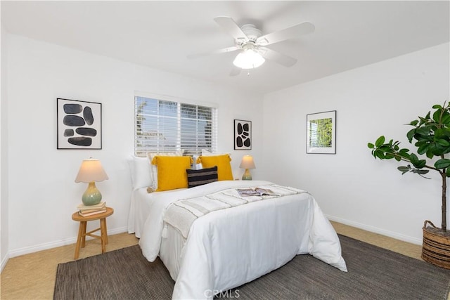 bedroom featuring carpet flooring, a ceiling fan, and baseboards