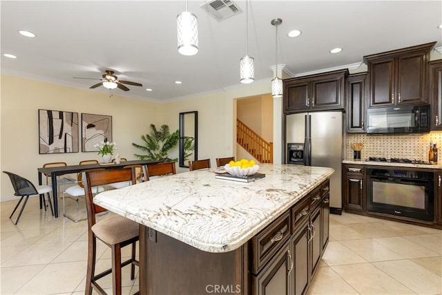 kitchen with black appliances, light tile patterned floors, visible vents, and ornamental molding