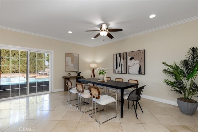 dining area with light tile patterned floors, baseboards, and ornamental molding