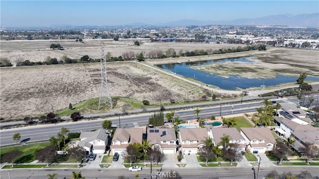 birds eye view of property featuring a residential view and a water view